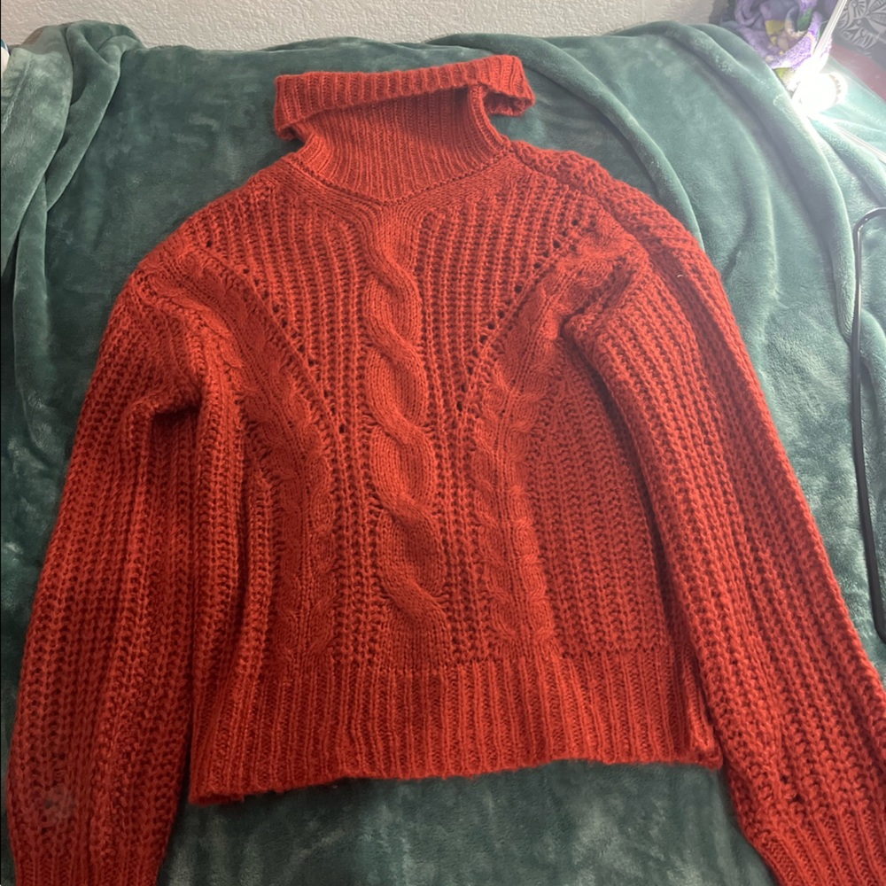 Orange sweater size large but can fit Xl